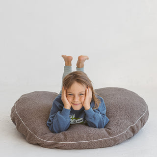 Big floor chair for nursery in grey boucle